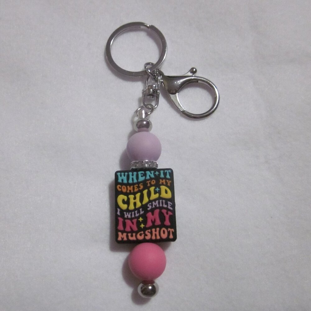 Pink and Purple Mugshot Keychain.